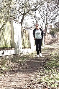 Naomi Benet Taking A Leek Near Abandoned Building