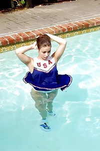This Filthy Cheerleader Gets Dirty And Dives In A Swimming Pool Nude And Starts Touching Her Cunt In This Pics